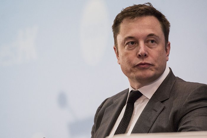 elon-musk-tesla-ceo-speaks-forum-suit elon-musk-tesla-ceo-speaks-forum-suit